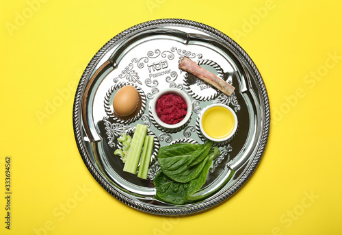 Fotografie, Tablou Passover Seder plate (keara) with symbolic meal on yellow background, top view