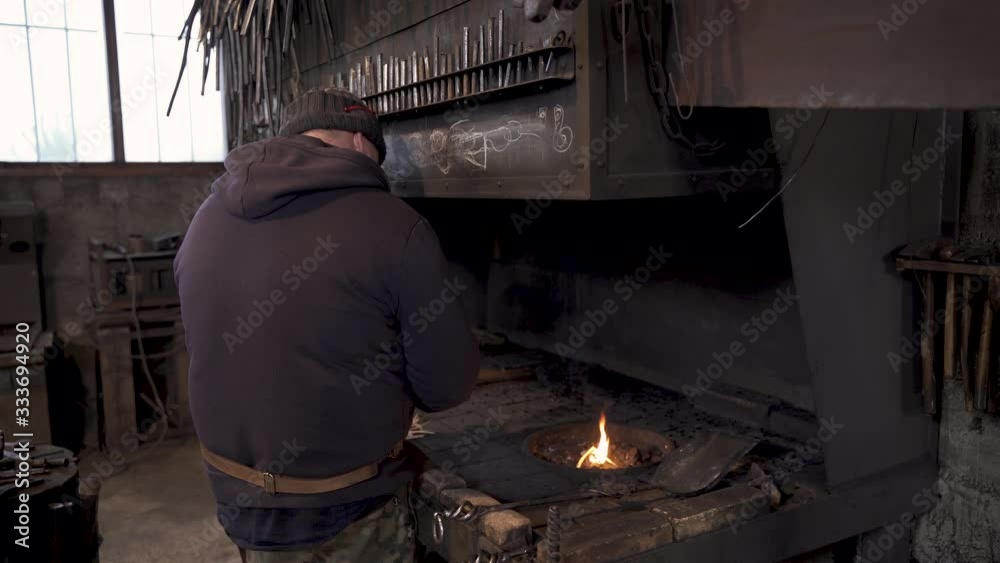 Blacksmith at forge Blacksmith at forge