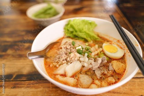 Thai traditional spicy seafood noodles or Tom Yum