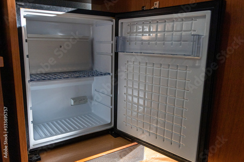 White empty fridge for the Minibar in the hotel room