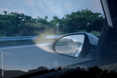 Jeju Island scenery in the rearview mirror.