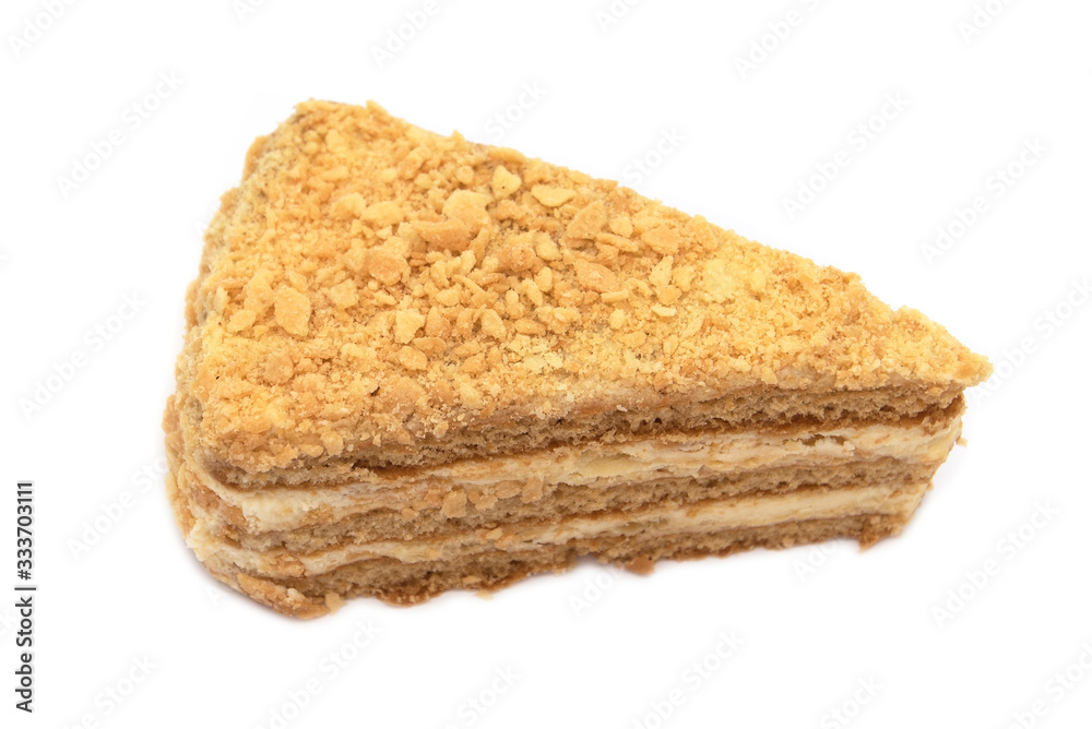 Slice of Honey Cake with cream isolated on white Background Slice of Honey Cake with cream isolated on white Background
