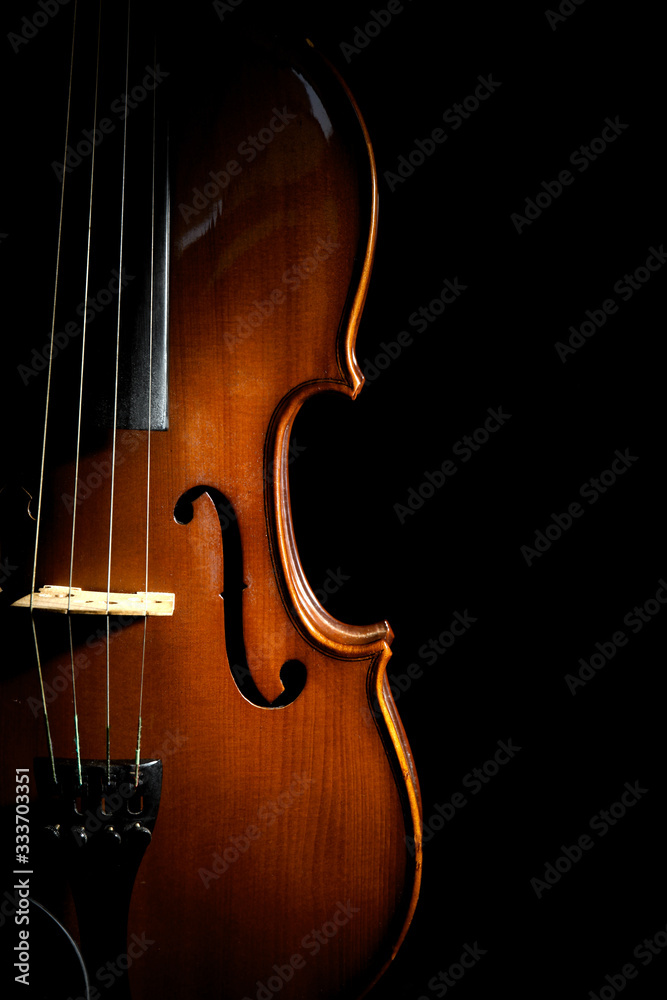 Beautiful classic wooden violin on black background Beautiful classic wooden violin on black background