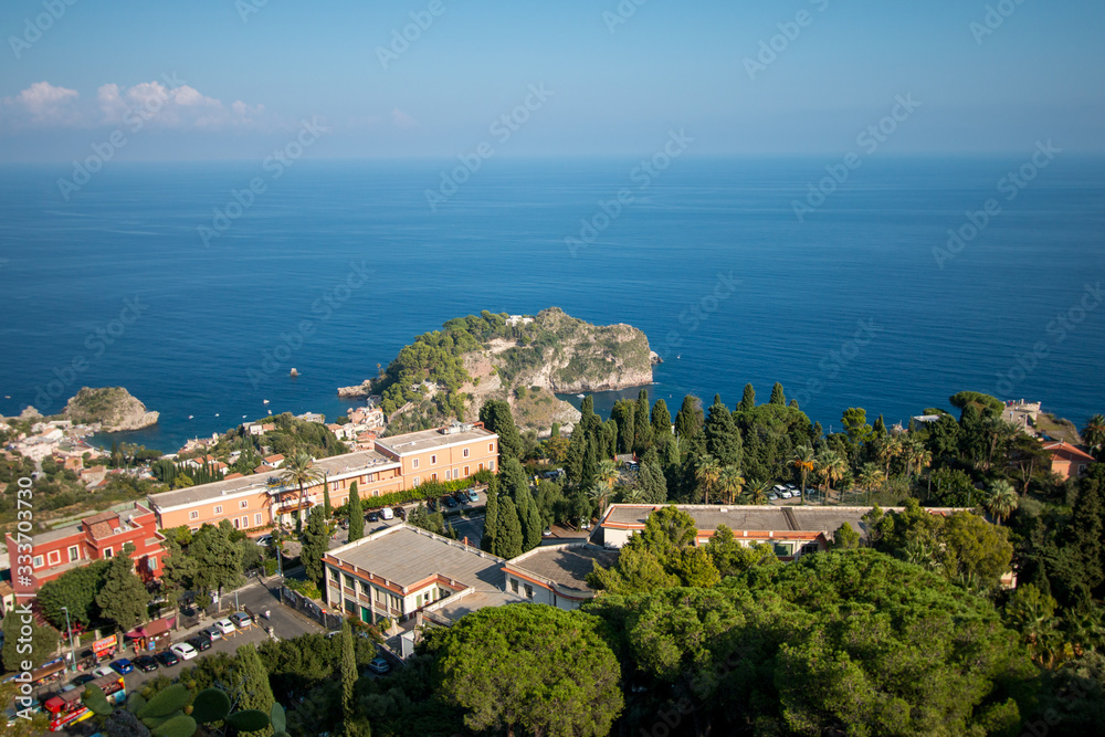 Beautiful landscape of Taormina, Italy. Sicilian seascape with beach and island Isola Bella. Travel photography.