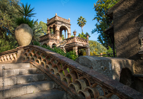 Tableau sur toile Picturesque evening view of Taormina Giardini della Villa Comunale city park, Sicily, Itale, Europe
