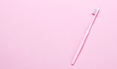 Fotobehang Tandarts Roze tandenborstel op roze ondergrond  © CamelCase