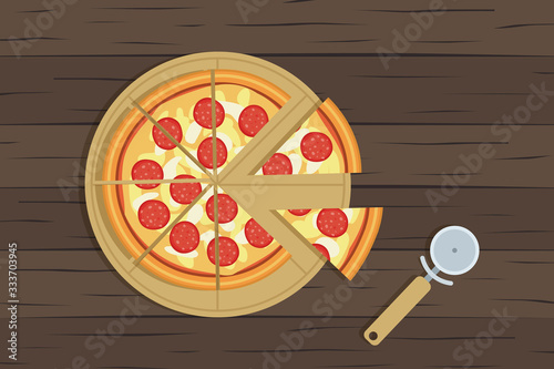 delicious sliced pepperoni pizza and knife on wooden table top view