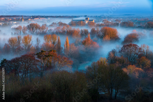 Winchester Cathedral in the early morning dawn mist