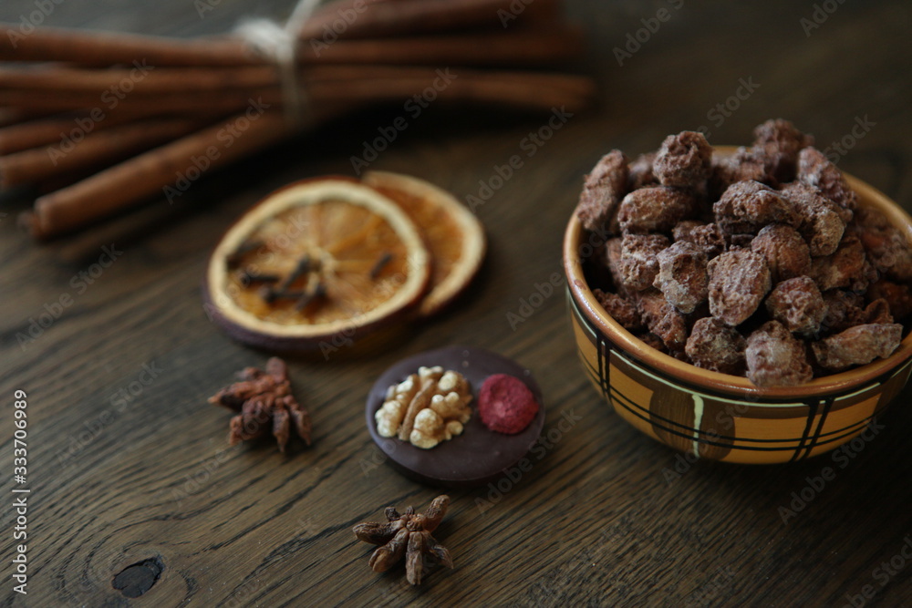 Mix nuts, dry fruits and chocolate at ceramic bowl on the wooden table. rustic style. tasty and delicious sweeties. Mix nuts, dry fruits and chocolate at ceramic bowl on the wooden table. rustic style. tasty and delicious sweeties.