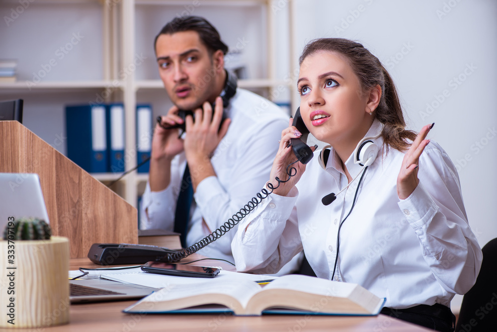 Call center operators working in the office Call center operators working in the office