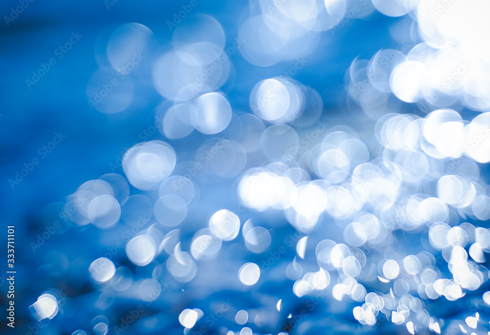 Abstract glare background on a blue background, bokeh background and texture for design Abstract glare background on a blue background, bokeh background and texture for design