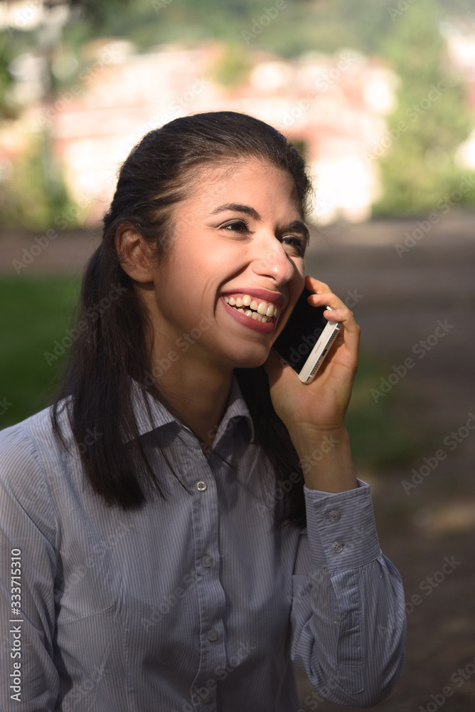 Confident business woman talking on the phone