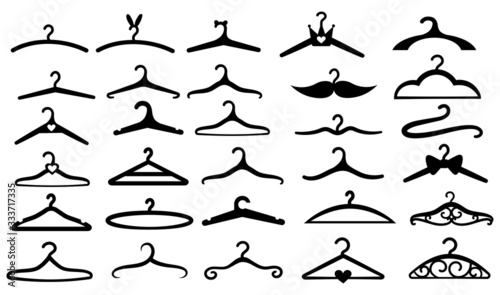 Set of hangers. Collection of silhouettes of stylized hangers made of wood, metal for clothes. Set of wardrobe hangers in a funny and vintage style. Vector illustration on white background.