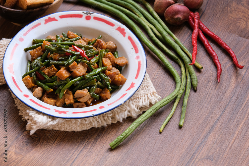traditional indonesian food. asian culinary oseng tempe mixed with long beans