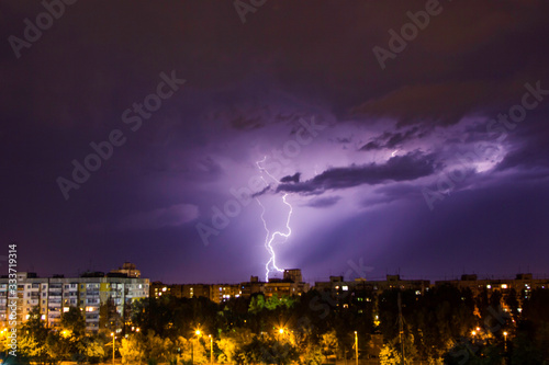 Fototapeta Naklejka Na Ścianę i Meble -  thunderstorm and lightning over the city at dark night