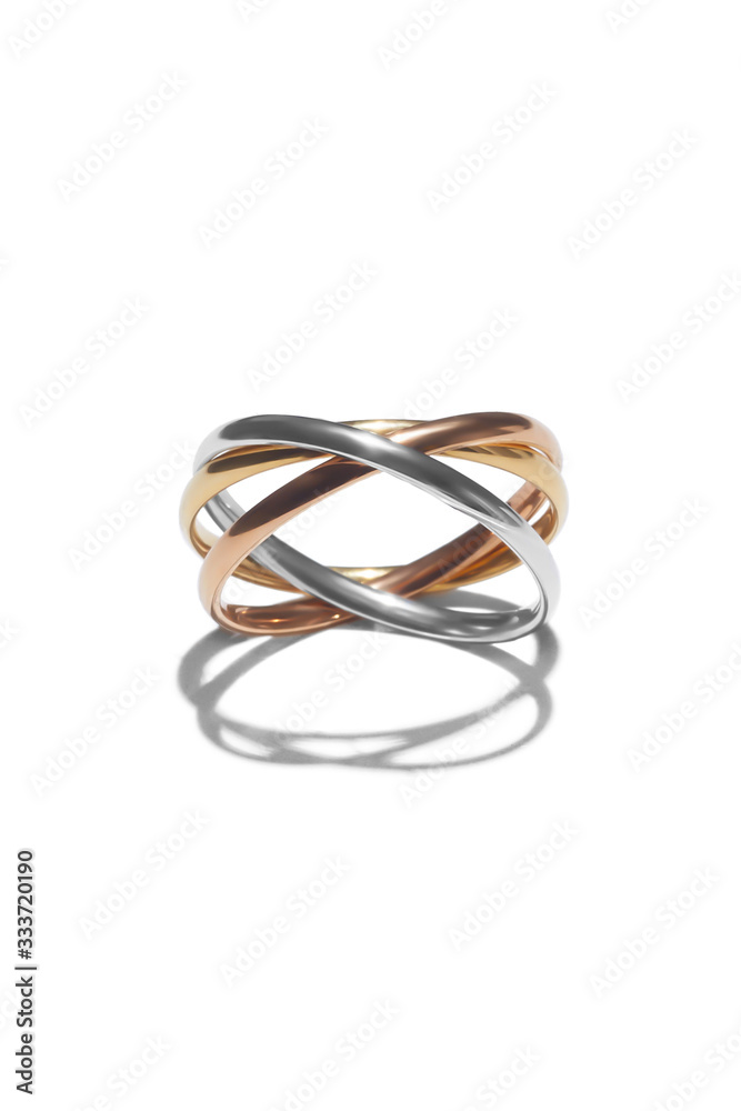Close-up shot of a tricolour rolling ring symbolizing friendship, loyalty and love. The unique ring is isolated on the white background. Close-up shot of a tricolour rolling ring symbolizing friendship, loyalty and love. The unique ring is isolated on the white background.