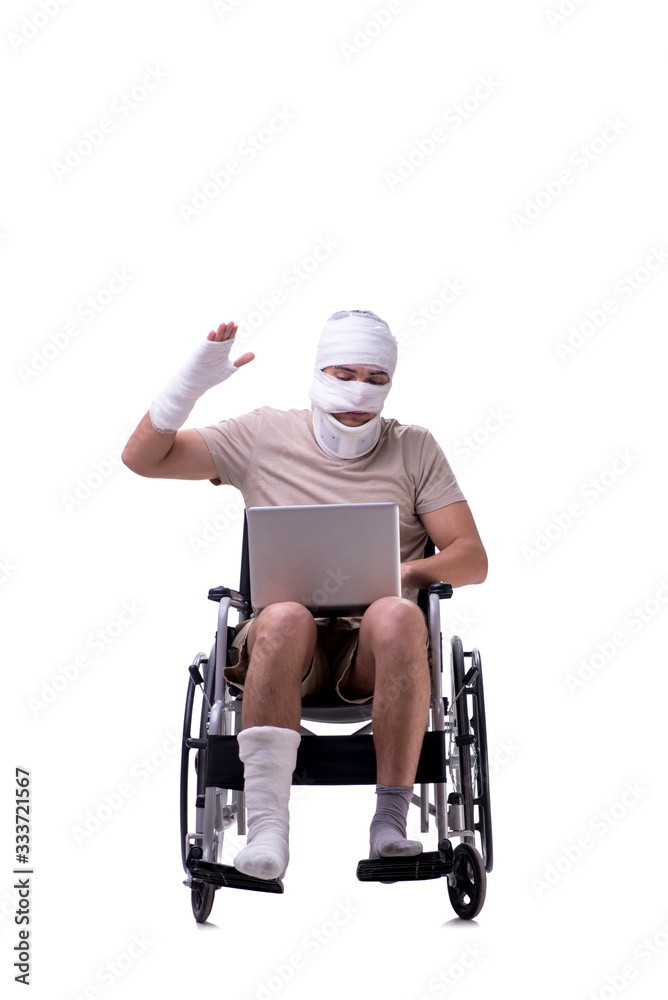 Injured man in wheel-chair isolated on white Injured man in wheel-chair isolated on white