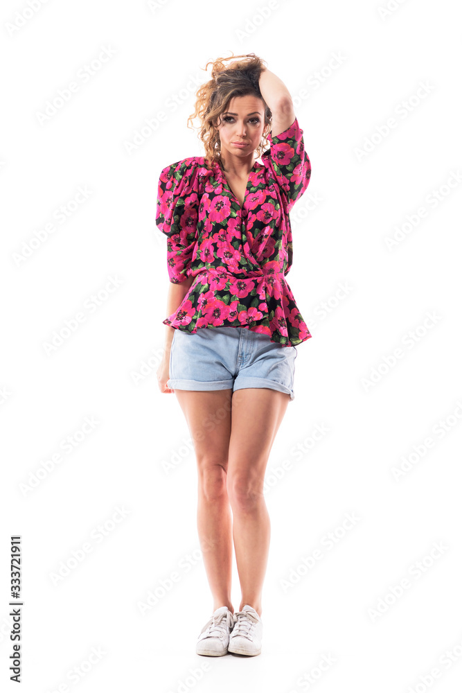 Wistful longing pretty young pensive woman holding hair and looking away thoughtfully. Full body isolated on white background. Wistful longing pretty young pensive woman holding hair and looking away thoughtfully. Full body isolated on white background.