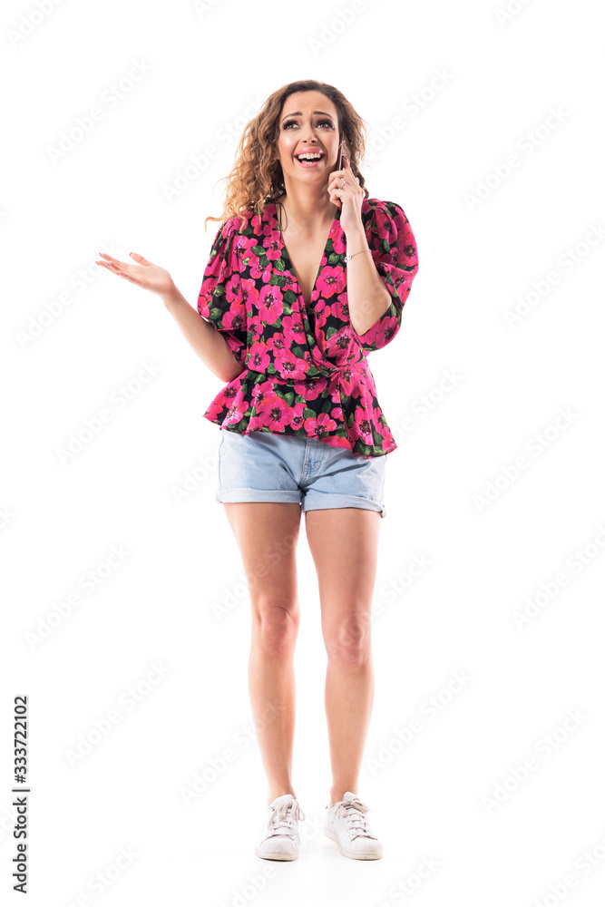 Happy excited cheerful young beautiful woman having phone call speaking on the cell phone. Full body isolated on white background. Happy excited cheerful young beautiful woman having phone call speaking on the cell phone. Full body isolated on white background.