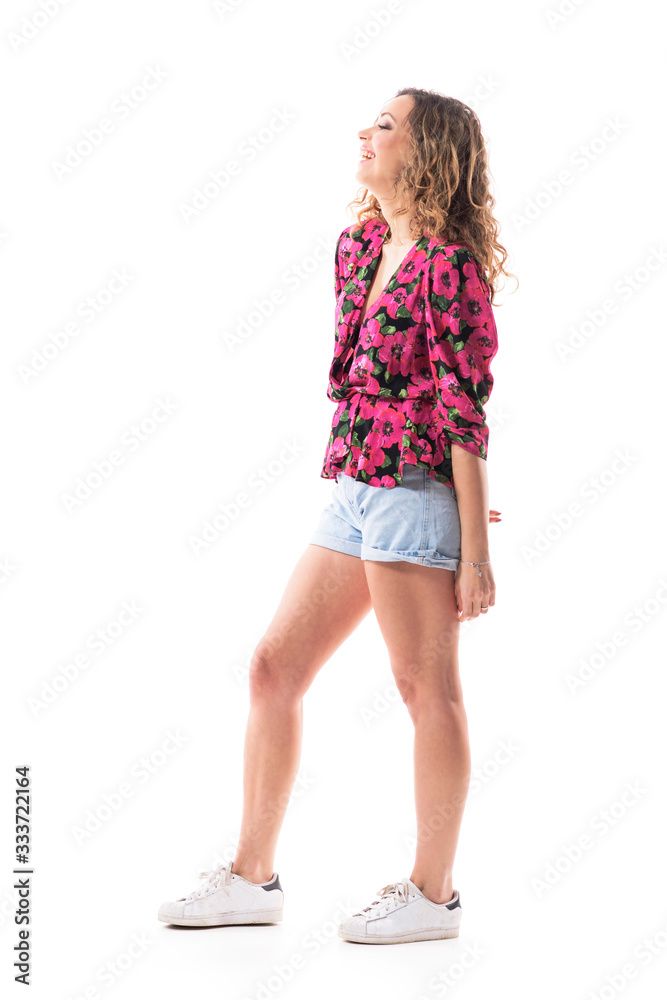 Naklejka premium Relaxed carefree woman beauty laughing in summer stylish casual clothes. Side view. Full body isolated on white background. 