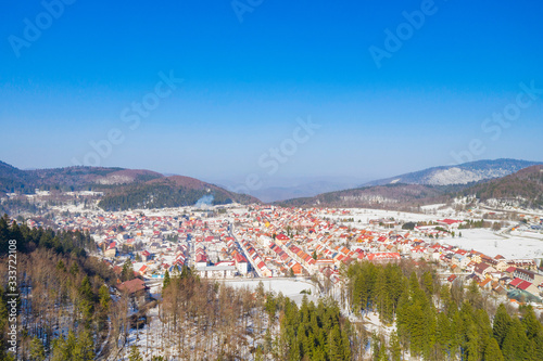 Croatia, drone aerial view of the town of Delnice in Gorski kotar in winter, mountain landscape in background