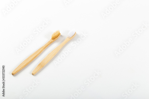 Toothbrushes made of eco materials  natural wood. On white background.