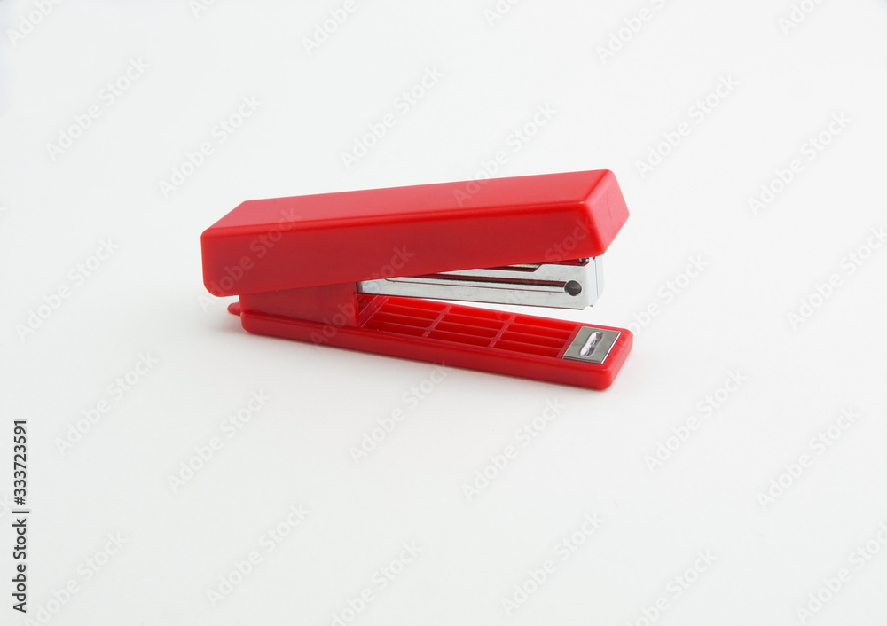 red office stapler on a white background red office stapler on a white background
