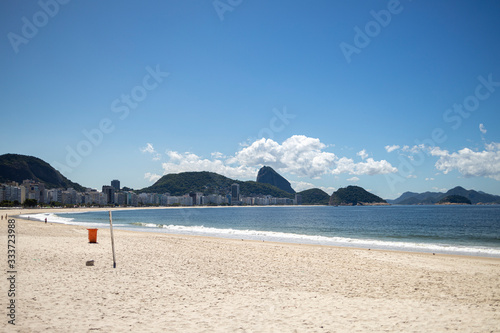 Near empty Copacabana beach with the Sugarloaf mountain in the background during the COVID-19 Corona virus outbreak in Rio de Janeiro, Brazil