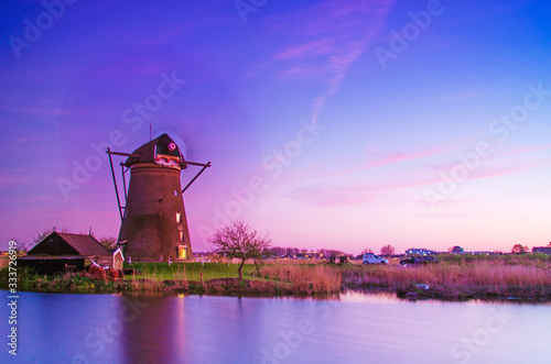 Obraz na płótnie breathtaking beautiful inspirational landscape with windmills in Kinderdijk, Netherlands at sunset. w salonie