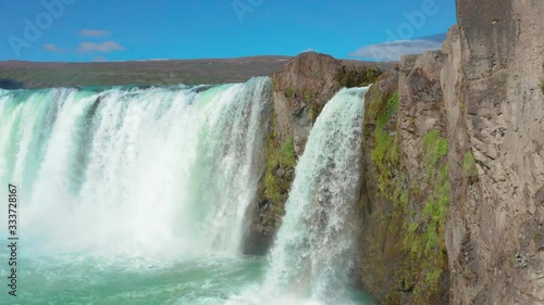 Aerial flight over Godafoss waterfall with Rainbow photo