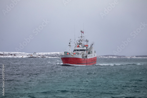 Fishing boat through Brønnøysundet in snowy weather, Northern Norway - Atløy Viking