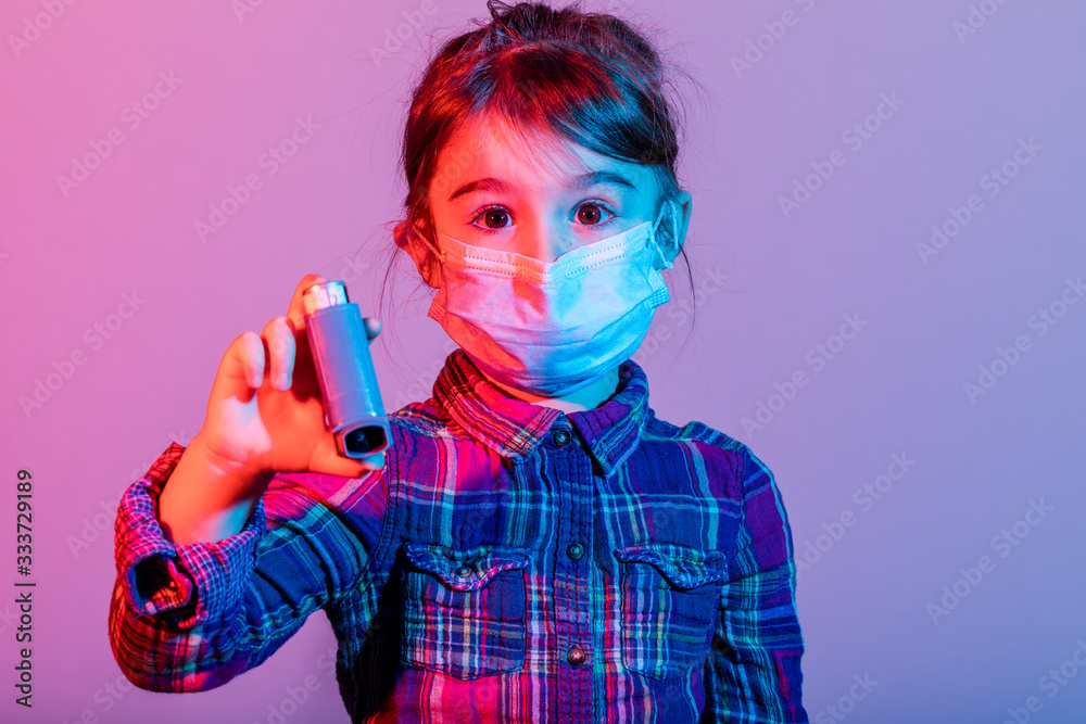 Little girl with fabric mask in color, protect herself from Coronavirus COVID-19. Little girl with fabric mask in color, protect herself from Coronavirus COVID-19.