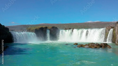 Aerial flight over Godafoss waterfall with Rainbow photo