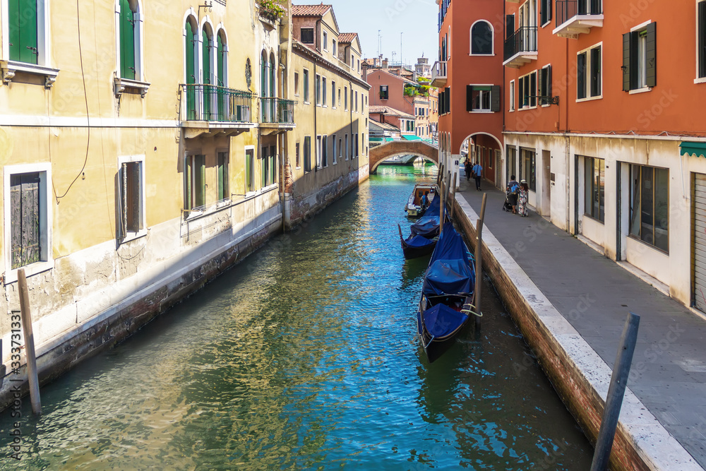 Venice canal with gondolas, peaceful view, Italy