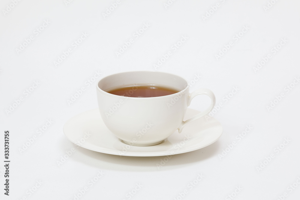 white cup with tea on a white background white cup with tea on a white background