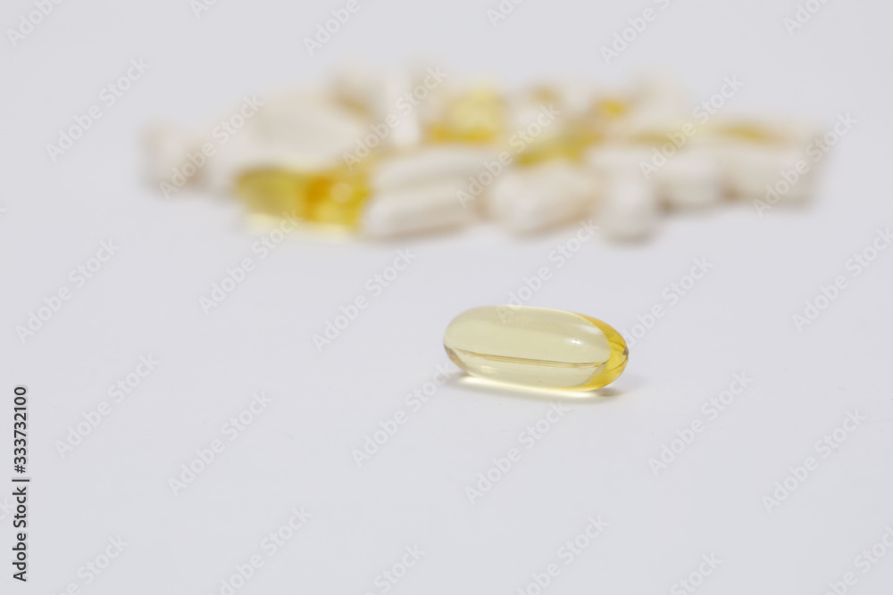 pills and vitamins on a white background pills and vitamins on a white background