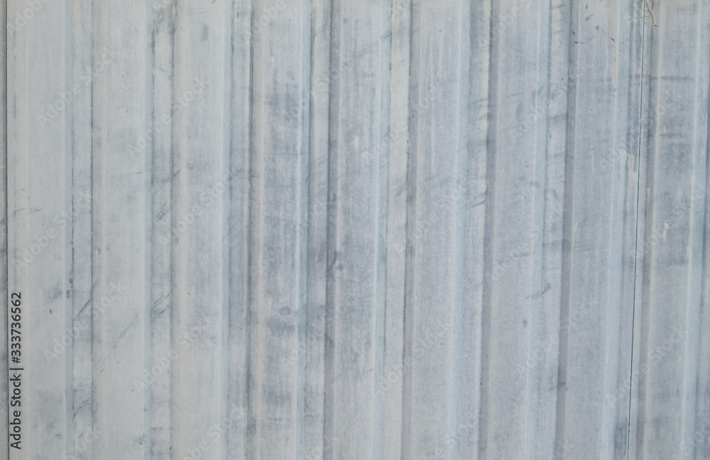 The metal sheet of the profiled sheet in the fence in white The metal sheet of the profiled sheet in the fence in white