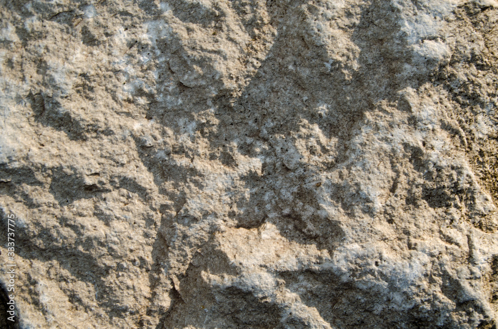 Texture of old stone photo in the sunlight Texture of old stone photo in the sunlight