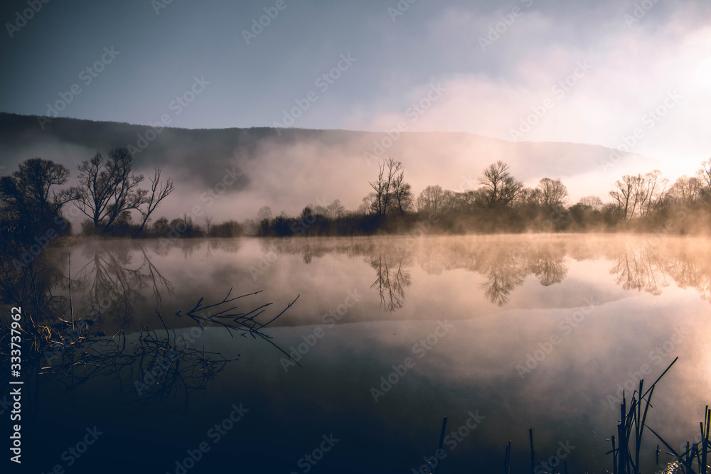 Fototapeta premium Mystical lake on a foggy morning