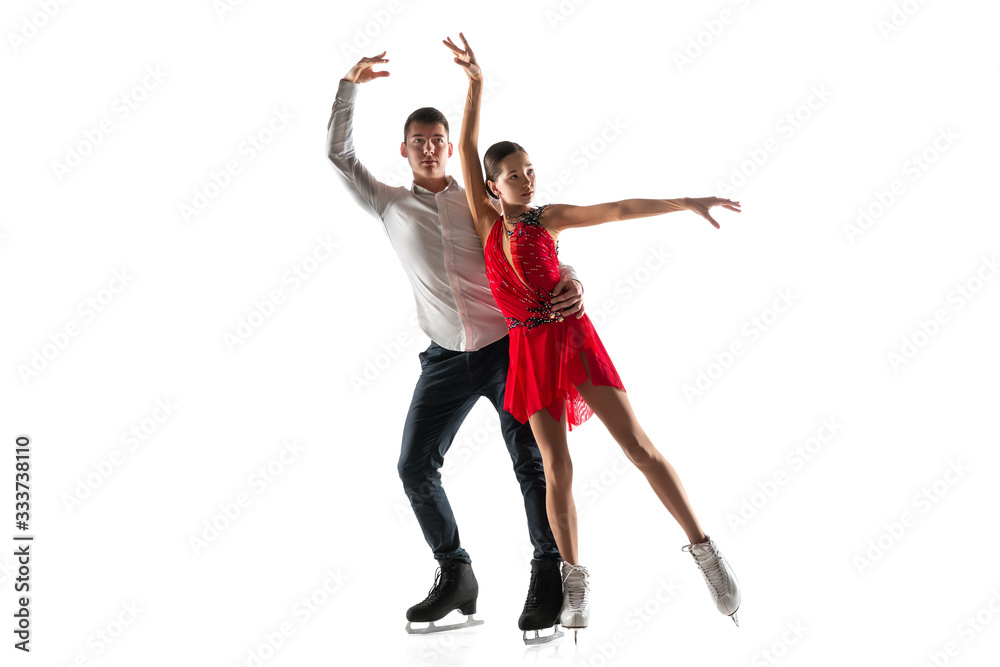 Duo figure skating isolated on white studio backgound with copyspace. Two sportsmen practicing and training in action and motion. Full of grace and weightless. Concept of movement, sport, beauty. Duo figure skating isolated on white studio backgound with copyspace. Two sportsmen practicing and training in action and motion. Full of grace and weightless. Concept of movement, sport, beauty.