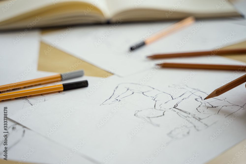 How to draw class of many figure drawing pencil and marker sketches. The artist worskspace with male and female drawings and pencils on the white paper, art, craft, creativity, inspiration, concepts