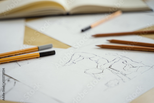 Wallpaper Mural How to draw class of many figure drawing pencil and marker sketches. The artist worskspace with male and female drawings and pencils on the white paper, art, craft, creativity, inspiration, concepts Torontodigital.ca