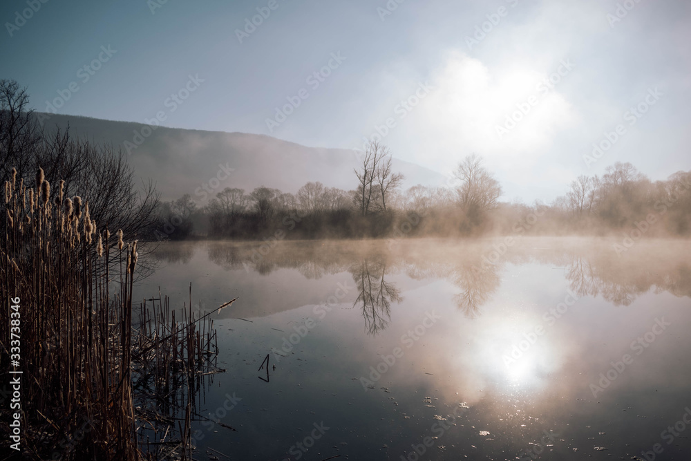 Mystical lake on a foggy morning Mystical lake on a foggy morning