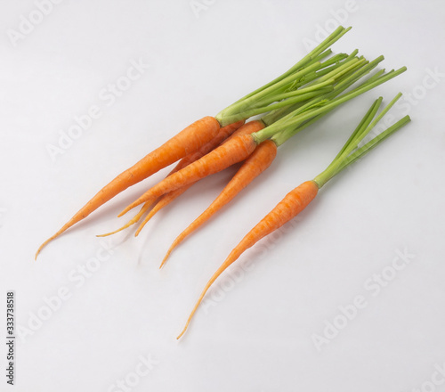 Bunch of baby carrots isolated on white