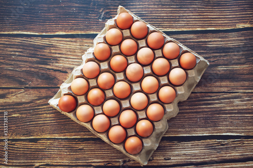top view Eggs on the panel on the vintage brown wooden floor