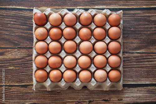 top view Eggs on the panel on the vintage brown wooden floor