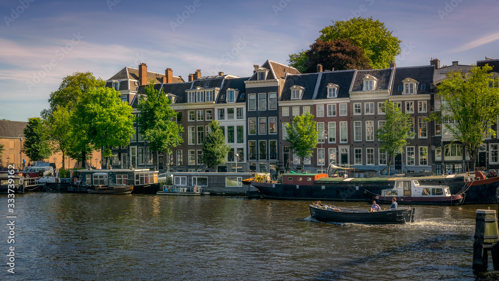 Houses and boats on the Amstel canal.