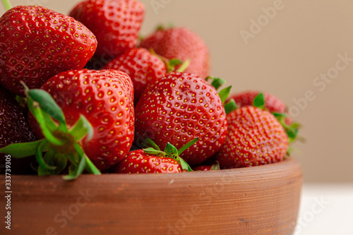 Fresh juicy large strawberry in a bowl.