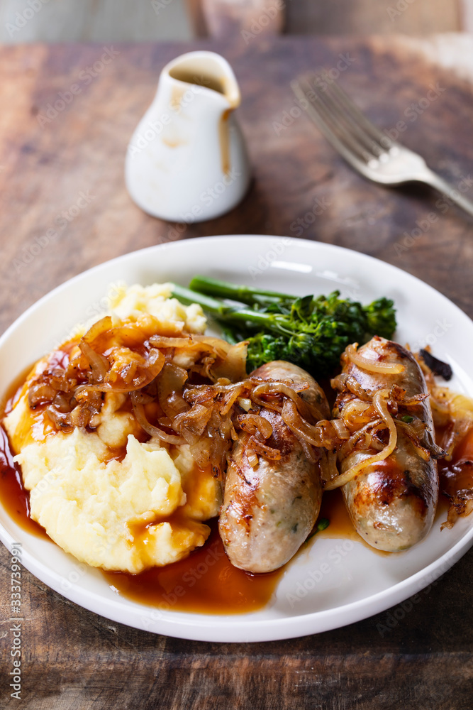 Sausages with fried onions and mashed potatoes Sausages with fried onions and mashed potatoes