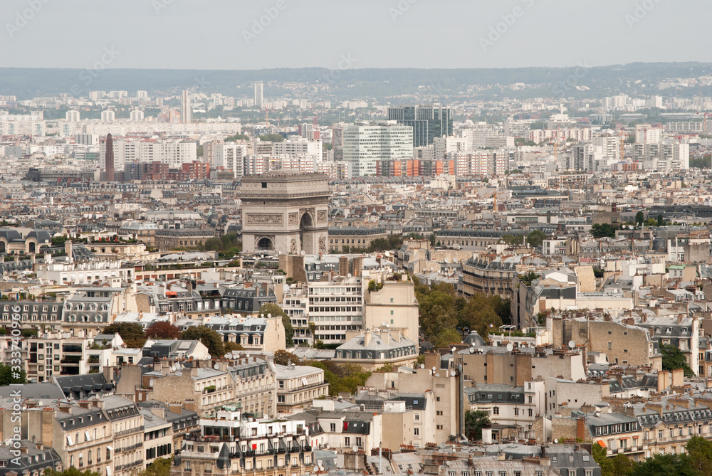 View of the city of paris with the triumphal arch from the eiffel tower.